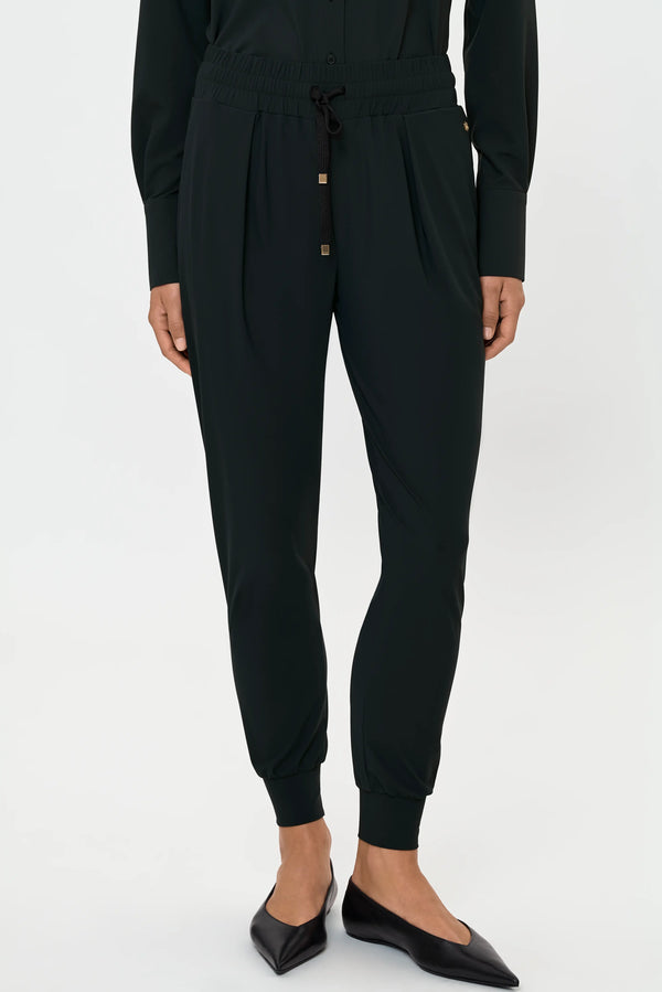 Forest green track pants with drawstring waist, cropped front view
