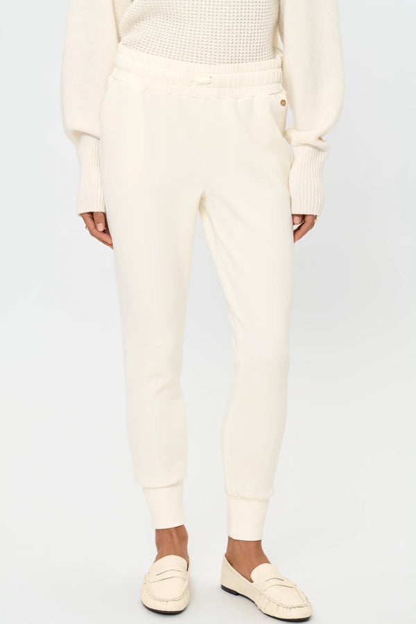 Ivory stretch jogger pants with ribbed cuffs, front view