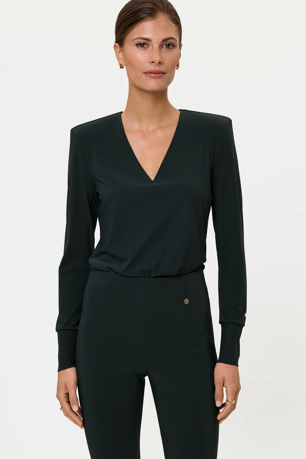 Front view of the MERENDA Blouse and ELLA Stretch Pants in Forest, styled as a tonal fitted set with a deep V-neckline and long cuffed sleeves.