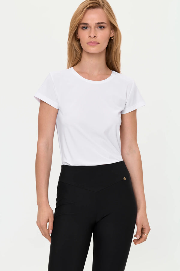 White short sleeve crew neck top tucked into black pants, front full body view