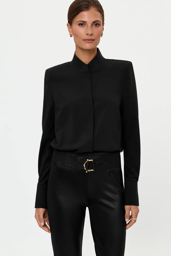 Close-up front view of the LEONTA Shirt, LEO Belt, and ELLA SHINES Stretch Pants, highlighting the clean black-on-black styling, structured cuff, tonal waistband texture, gold buckle hardware, and subtle shine contrast.
