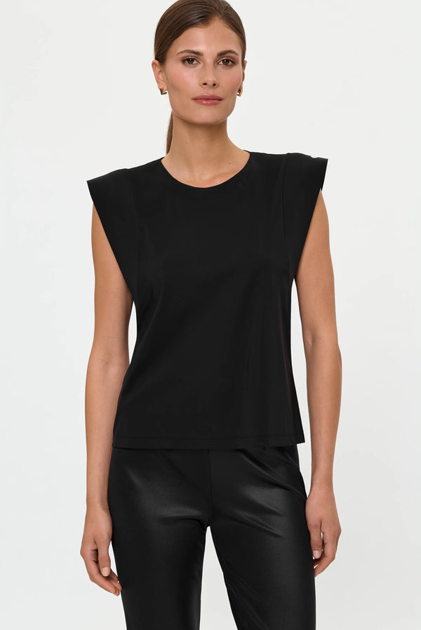 Close-up front view of the ERI Top in Black with ELLA SHINES Stretch Pants, emphasizing the round neckline, strong shoulder shape, soft fabric drape, and glossy high-waist pants.