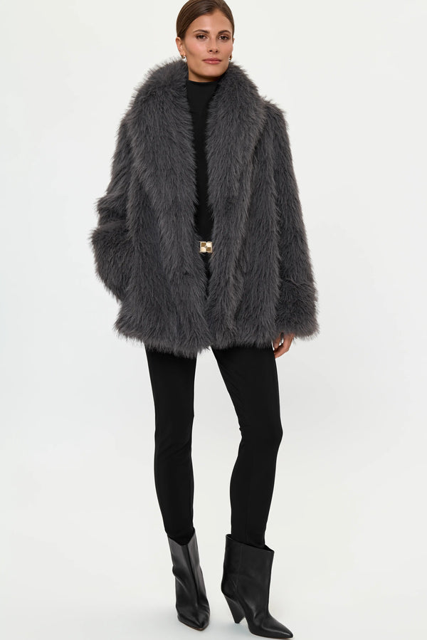 Full-length front view of the MARMOTA Faux Fur Coat in Crystal Grey styled over the LYNNIC Highneck Top and black EON Pants, showing the oversized faux-fur silhouette, open front, and black heeled boots.