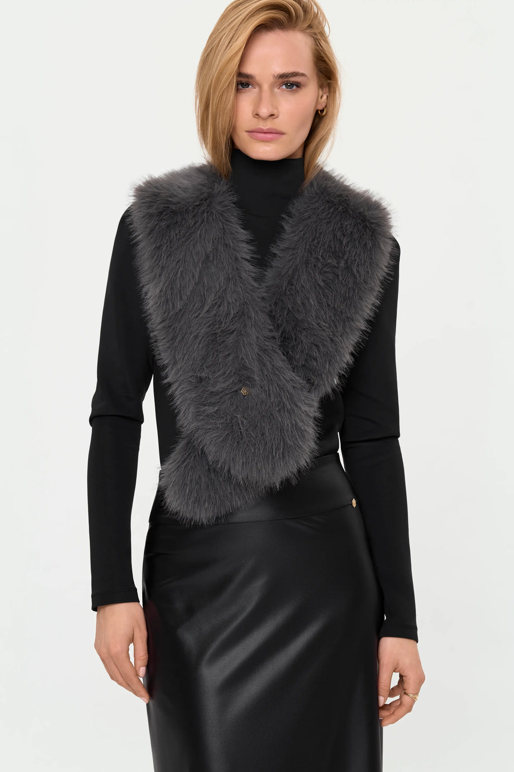 Mid-length front view of the BRINA Faux Fur Scarf in Crystal Grey styled over the LYNNIC Highneck Top and VITA Faux Leather Skirt, emphasizing the plush texture and layered winter look.